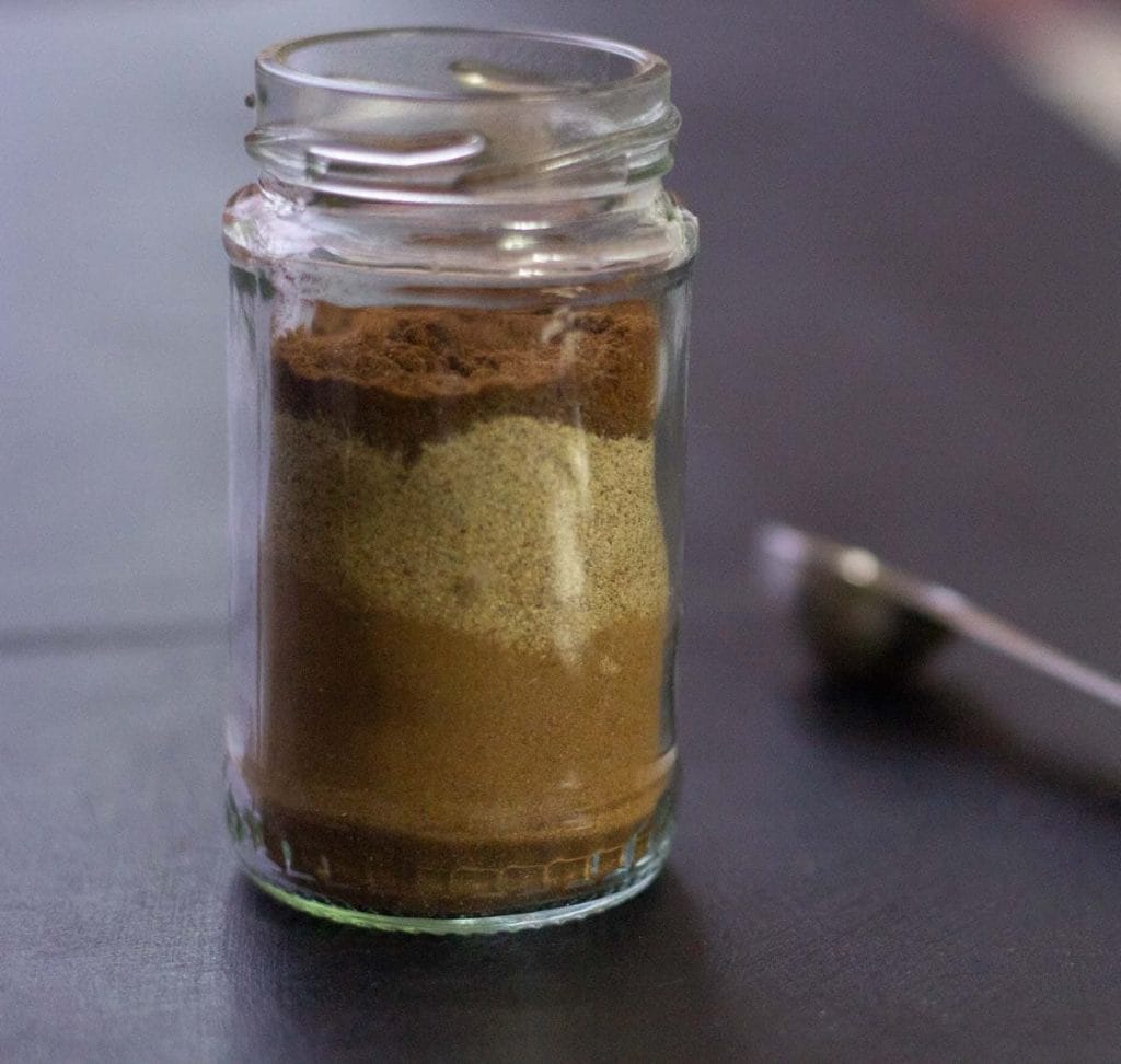 Small jar of gingerbread spices layered