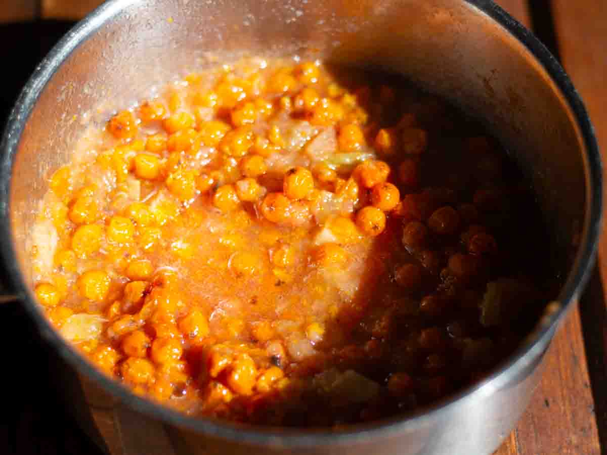 cooked rowan berries in a stainless steel pot