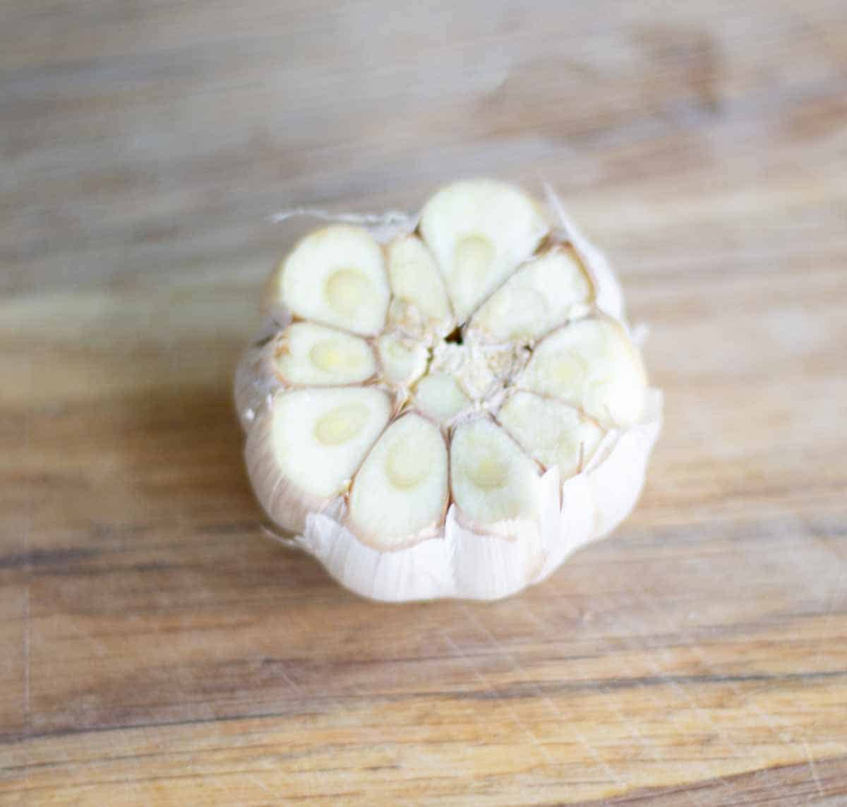 a whole head of garlic with the top removed