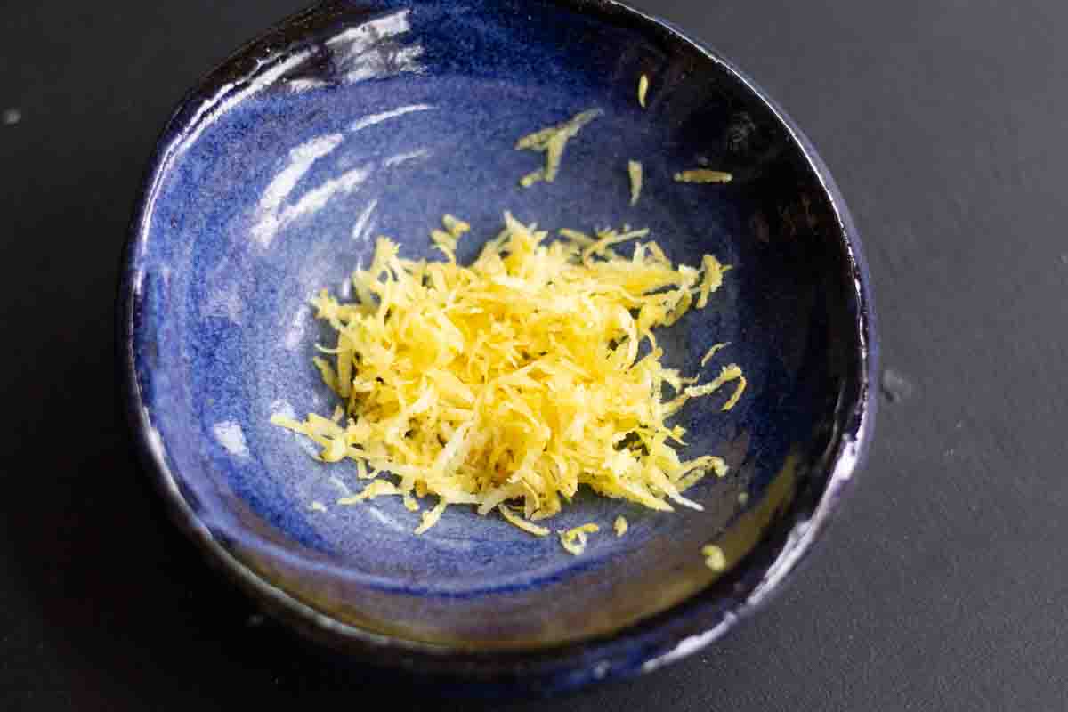 lemon zest in a blue ceramic bowl
