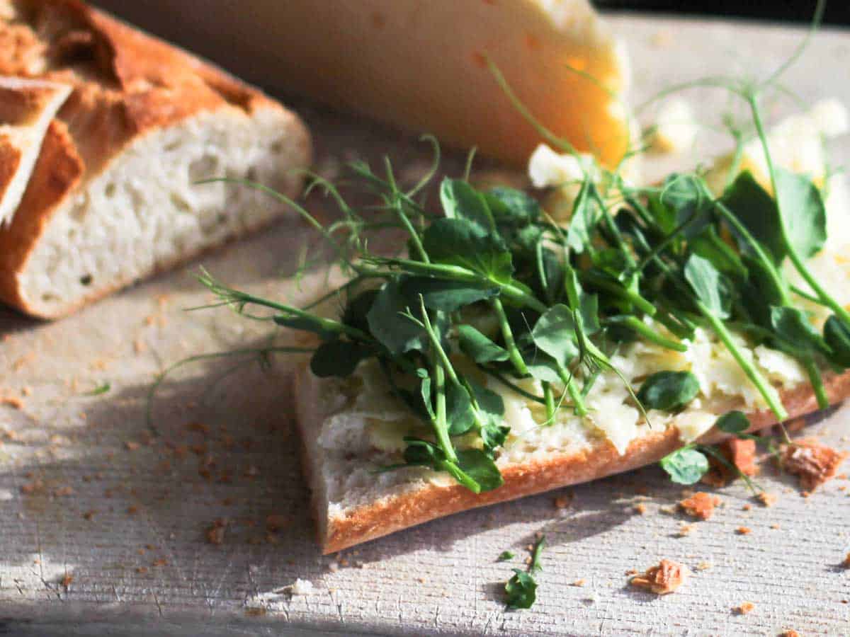 pea shoots on crunchy baguette