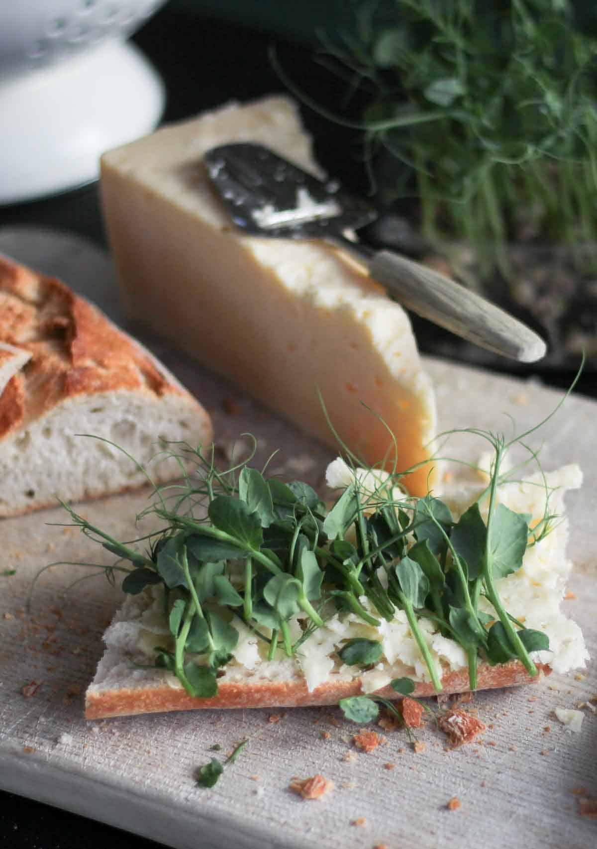 pea shoots garnishing a crusty baguesste sandwich